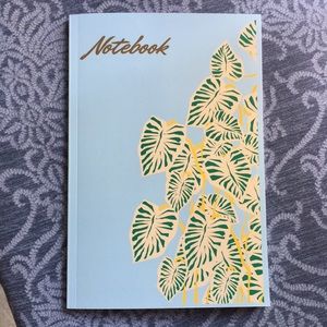 A colorful garden inspired 6”x9" notebook with 120 pages paperback